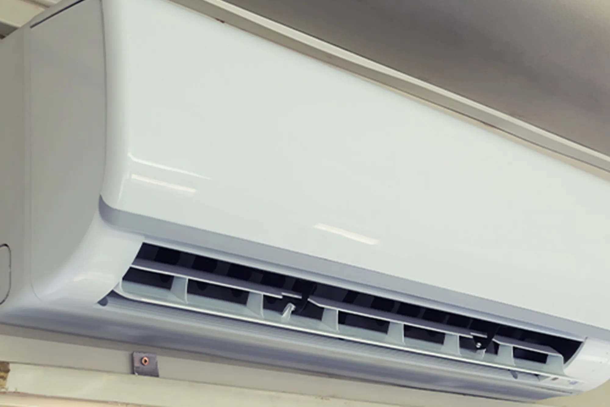 What is the function of an AC compressor